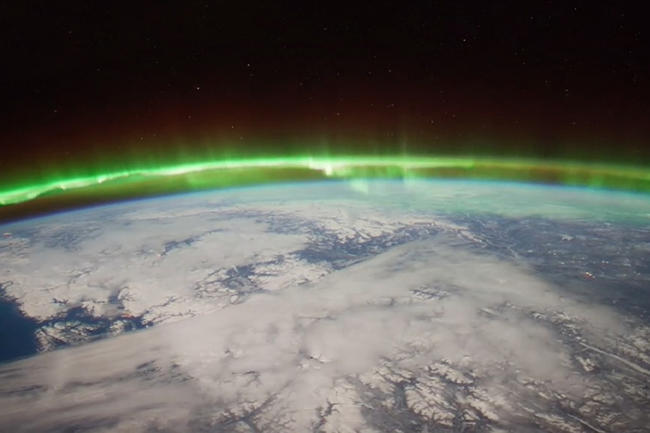 Green aurora over Earth observed from space